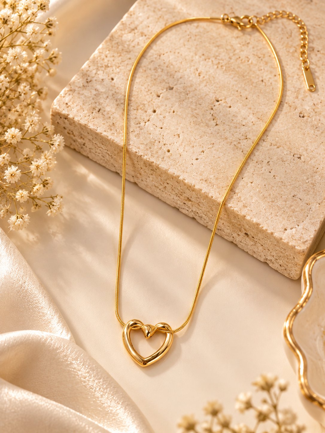 Heart pendant gold chain necklace with anti-tarnish finish for women, featuring a delicate heart-shaped design.