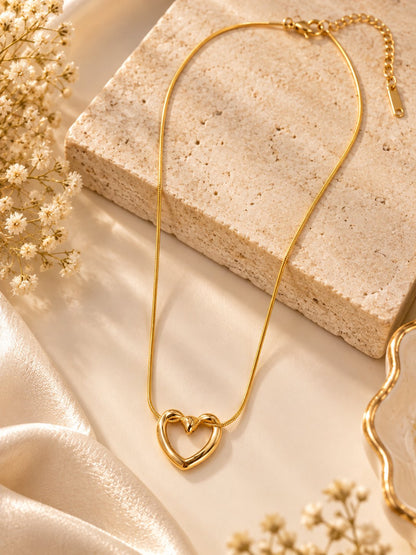 Heart pendant gold chain necklace with anti-tarnish finish for women, featuring a delicate heart-shaped design.