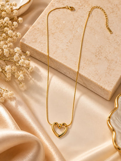 Heart pendant gold chain necklace with anti-tarnish finish for women, featuring a delicate heart-shaped design.