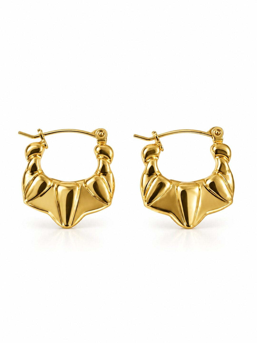 Golden sculpted statement hoop earrings with anti-tarnish finish for women, featuring a bold geometric design.